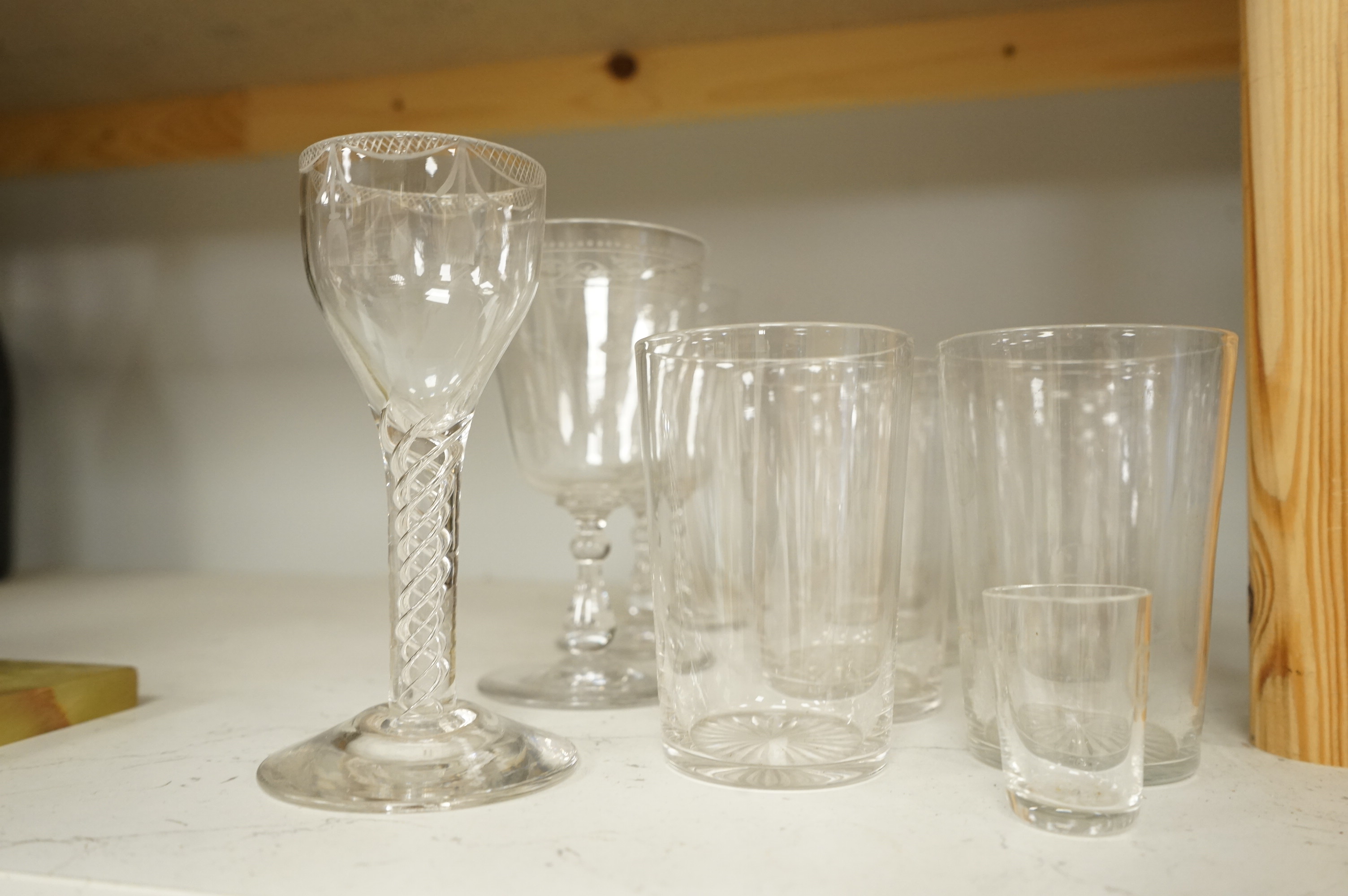 A pair of engraved glass goblets, seven tumblers engraved with the initial G and an air twist stem wine glass, etc. (12)